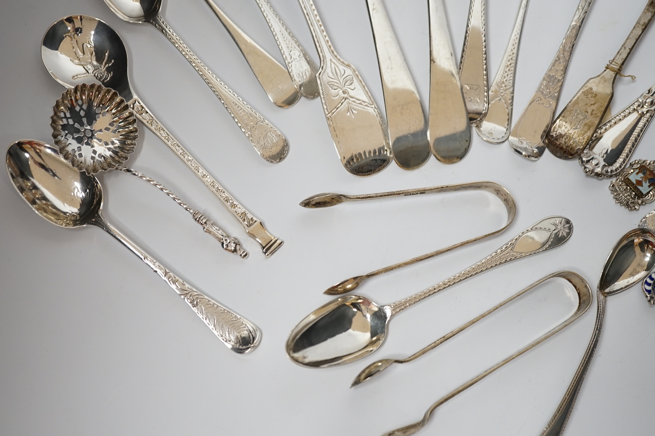 A quantity of assorted 19th century and later silver flatware, various dates and makers including base mark table spoons, berry spoons, sifter spoon etc. together with an Scandinavian 925 and enamelled spoon and a plated